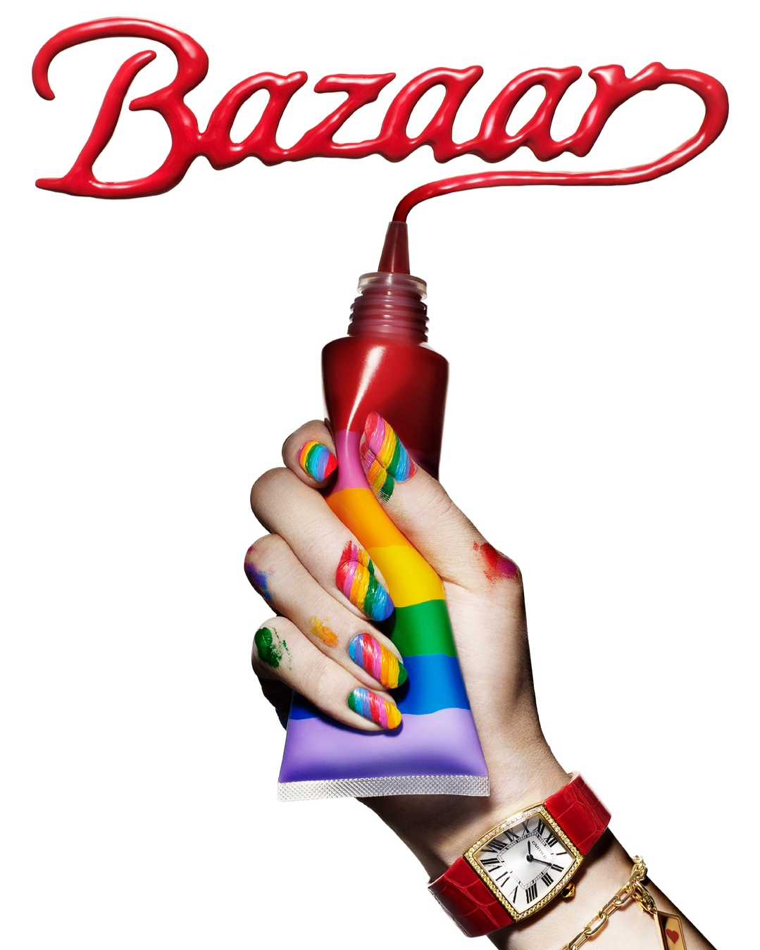 Close-up studio shot of a hand holding a paint tube, nails painted in rainbow colors, wearing a wristwatch, with red Bazaar text above.