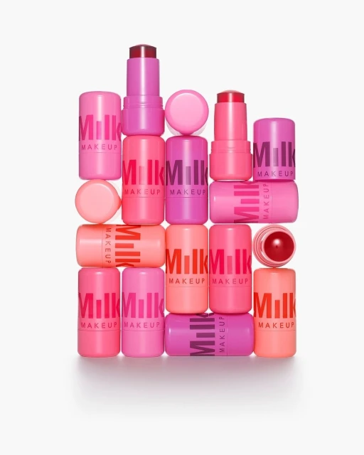 Multiple pink Milk Makeup chubby sticks stacked and displayed on a white background, cosmetic still life. Beauty product advertisement.