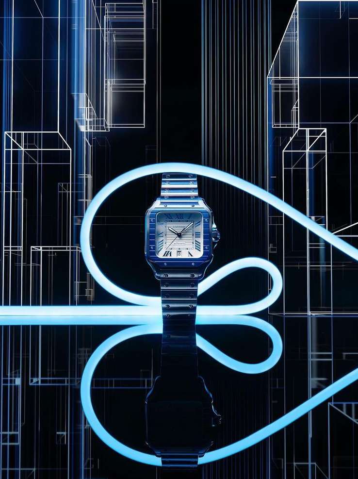 Blue Cartier watch on a black reflective surface, illuminated with geometric lighting against an architectural background.
