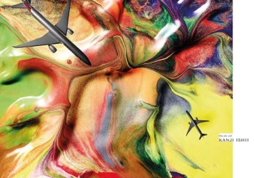 Two miniature commercial airplanes flying over a colourful abstract swirling paint texture resembling aerial landscape