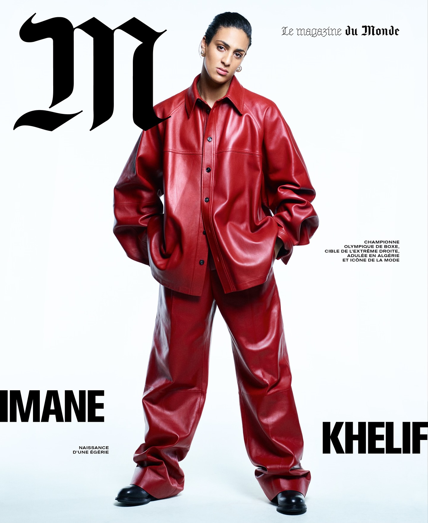 Imane Khelif posing on a Le Monde magazine cover, wearing a red leather suit with black shoes against a white background.