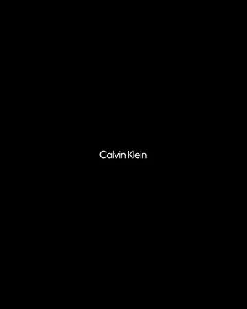 Calvin Klein brand advertisement featuring a minimalist design with the logo displayed against a dark background, showcasing the brand.