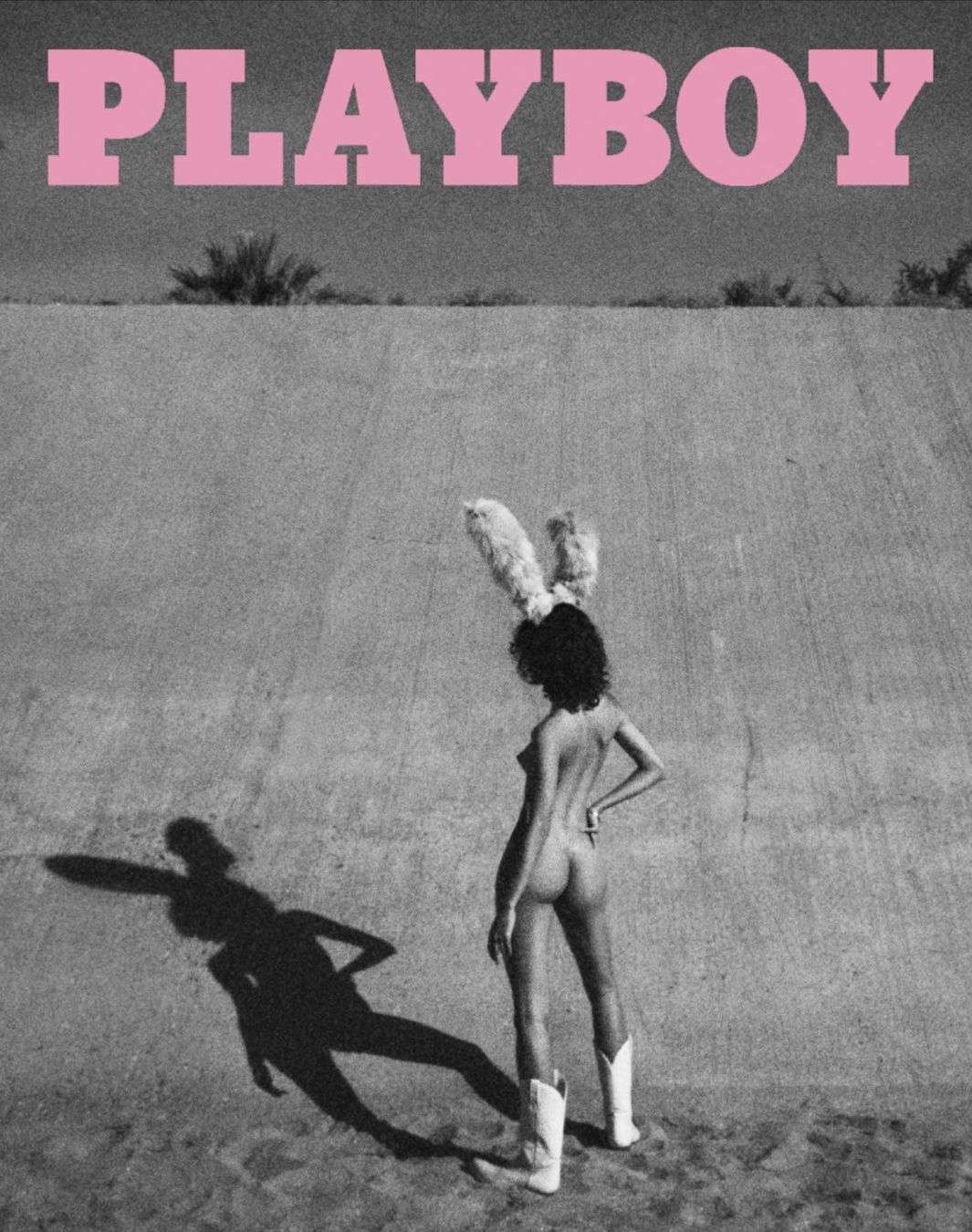 Black and white fashion editorial featuring a nude woman with bunny ears and cowboy boots posing outdoors with a retro, grainy filter.