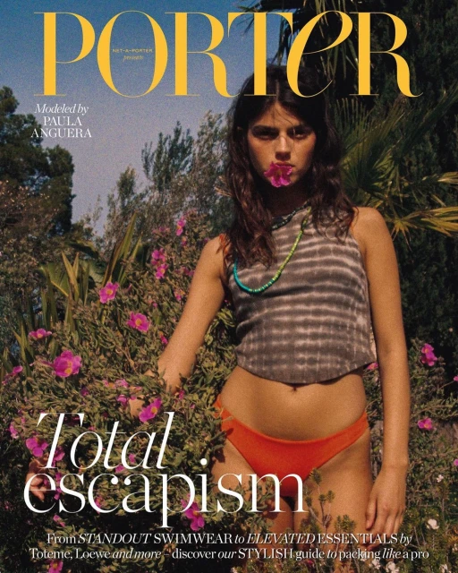 Fashion magazine cover featuring a young woman in swimwear surrounded by green foliage and pink flowers in a natural outdoor setting.