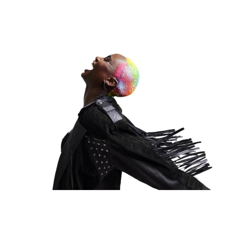 Person with rainbow hair wearing a black jacket looking up with an open mouth in a minimalist white background studio shot