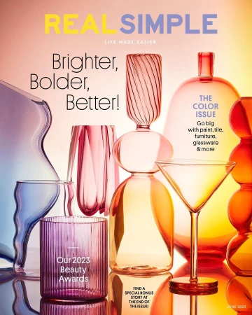 Real Simple magazine cover featuring an assortment of colorful glassware with reflections against a gradient color backdrop, June 2025.