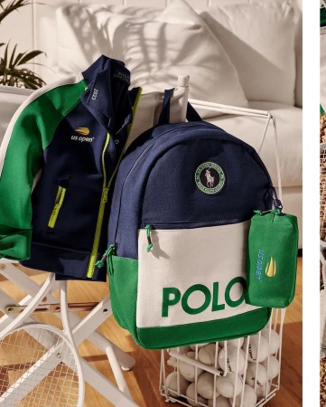 Sporting goods still life featuring a Polo Ralph Lauren backpack, jacket, and tennis balls, all in shades of blue, green, and white.