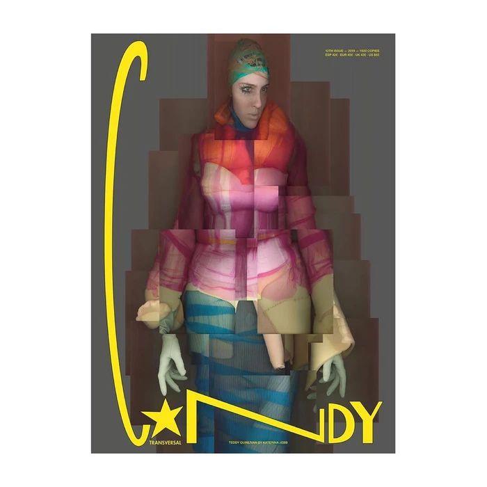 Model wearing patterned headscarf and layered colorful top against a grey background with yellow graphic text overlay.