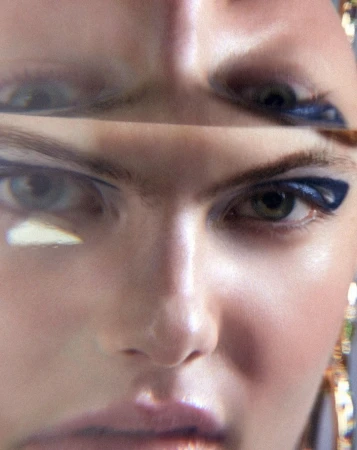 Close-up portrait of a woman's face with striking blue eyeliner, viewed through a distorting prism, creating a surreal effect on her features.