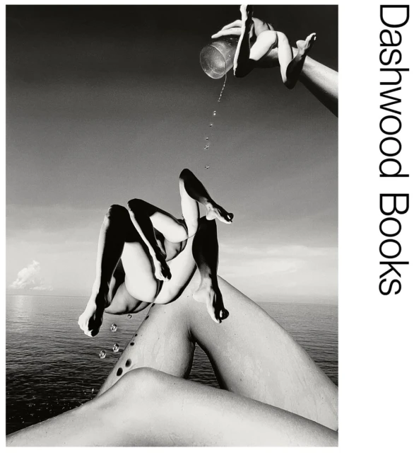 Black and white photographic collage of human limbs and torso against the sky and ocean, with a glass of water being poured.