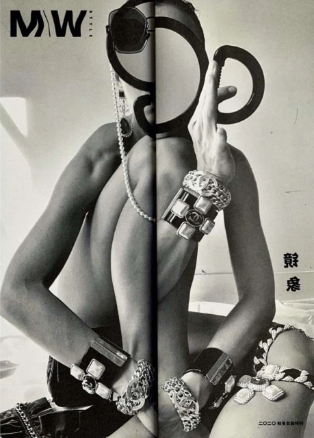 Black-and-white fashion shot in magazine: a model poses with jewelry, sunglasses, and striking shadow play, creating an edgy, unique visual.