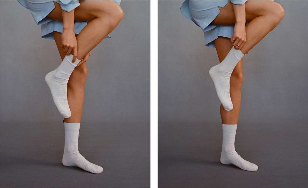 Two side-by-side images of a fair-skinned person wearing a blue outfit pulling up a white sock on their leg against a gray background.