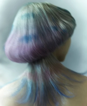 Close-up rear view of a person with short, layered hair dyed in pastel shades of blue, purple, and gray against a blurred light background.