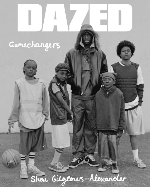 Black and white magazine cover shot of Shai Gilgeous-Alexander and a group of children in athletic apparel standing on a court.