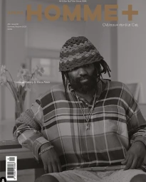 Portrait of Tremaine Emory wearing a patterned shirt and crocheted bucket hat, photographed by Katsu Naito for Arena Homme Plus.