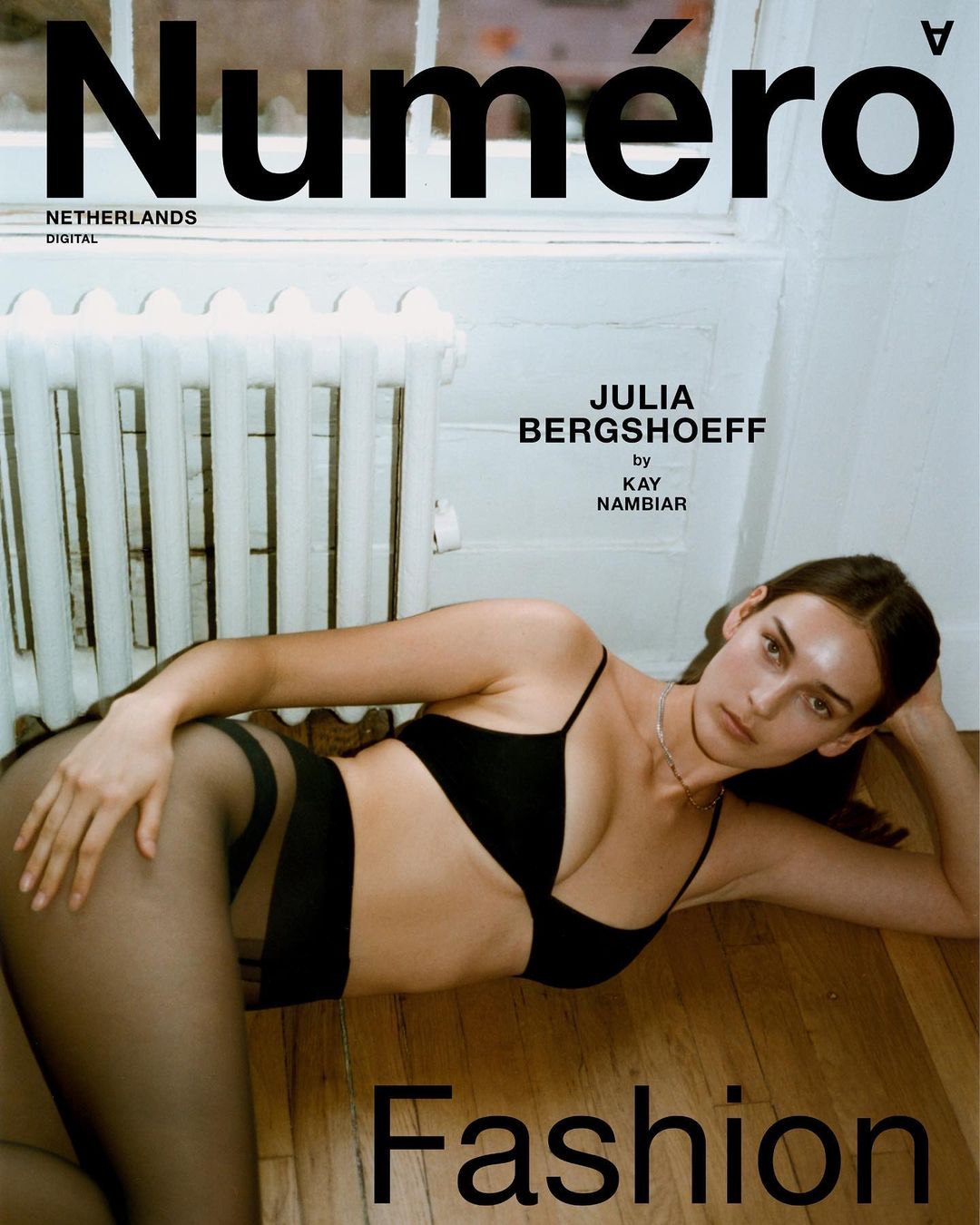 Magazine cover featuring Julia Bergshoeff in black lingerie lying on a hardwood floor near a radiator and a window with natural light.