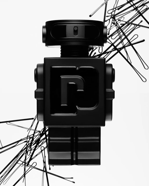 Black robot figure surrounded by hairpins on a white background, studio lighting, artful product shot.