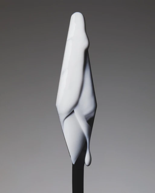 Abstract close-up of a white, stylized, cone-shaped object with smooth, flowing lines against a soft grey gradient background.