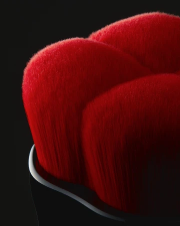 Macro shot of a red makeup brush head with densely packed bristles, set against a dark background, highlighting the texture and color.