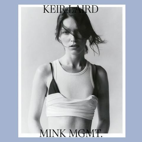 Black and white portrait of a woman in a white tank top against a white and light blue background, with overlaid black text.