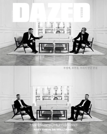 Two men in suits sit opposite each other in chairs on a magazine cover with a white couch, two square tables, and a window.