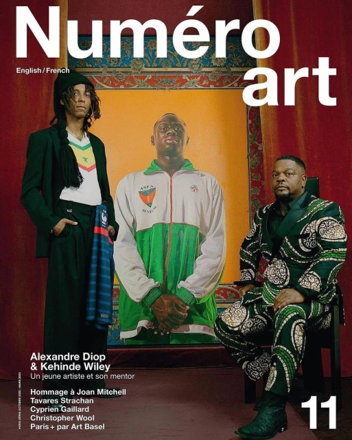 Numéro art magazine cover featuring two African men in stylish patterned suits and casual wear, alongside a portrait backdrop.
