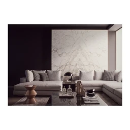 Modern sectional sofa in a living room with a marble feature wall and a black coffee table by Kensington Leverne
