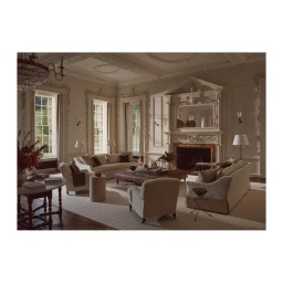 Elegant traditional living room interior with cream sofas, ornate crown molding, tall windows, and a marble fireplace.