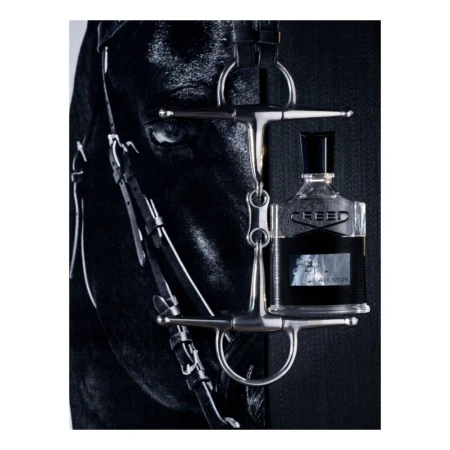 Equestrian-themed fragrance bottle hanging from a horse's bridle against a dark backdrop, highlighting the connection between luxury and equestrian sports.