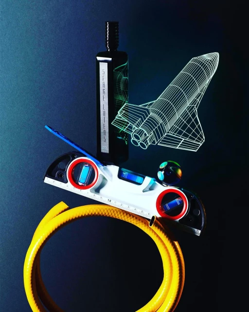 Still life of a bottle, level, hose, and spacecraft model against a dark background, creating a surreal and inventive composition.