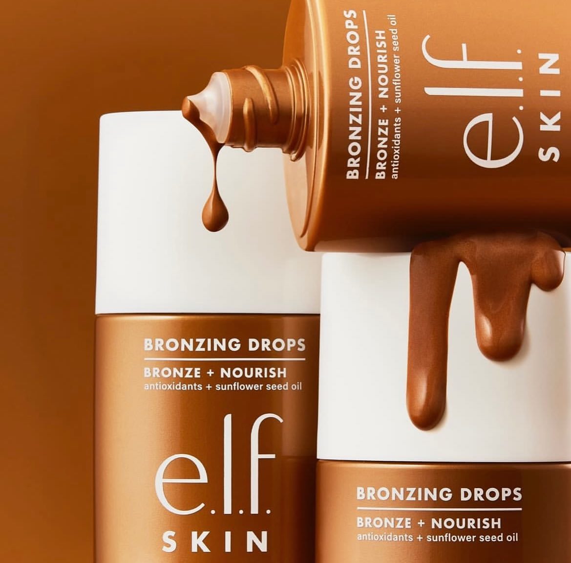 Cosmetic product image featuring bronze-colored bronzing drops from e.l.f. SKIN, highlighting the product's texture and packaging.