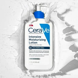 CeraVe Intensive Moisturizing Lotion pump bottle surrounded by a dynamic splash of white lotion against a light grey background.