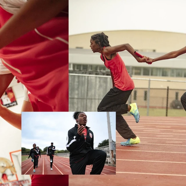 Track and field athletes in relay race exchange baton on outdoor running track in red and black uniforms; sports photography.