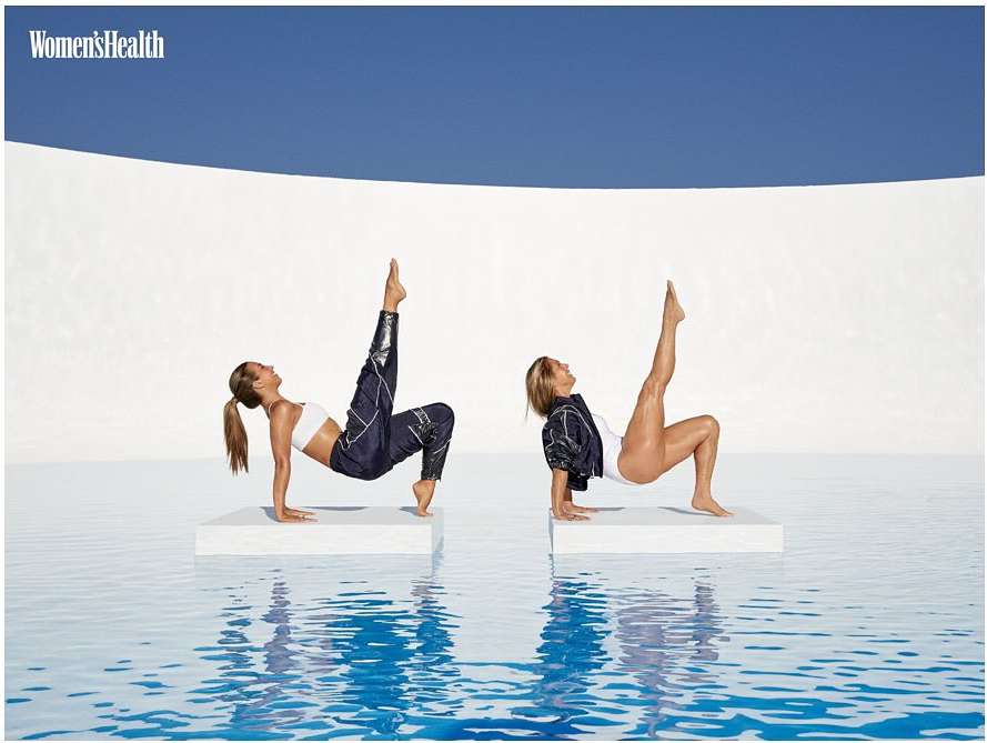 Two adult women in fitness attire practice arm-supported leg lifts atop white platforms in a blue-tiled pool against a white and blue background.