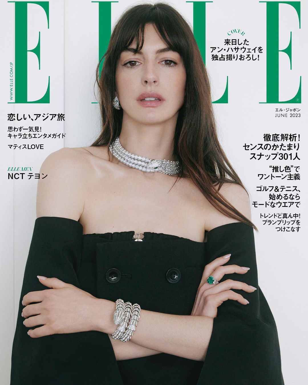 Anne Hathaway covers Elle Japan, June 2023 issue. The portrait shot features the actress in a black off-the-shoulder dress with jewelry.