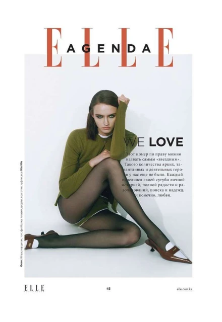 Magazine cover of Elle features a woman in tights and heels, shot in a studio setting, creating a visually striking and fashion-forward image.