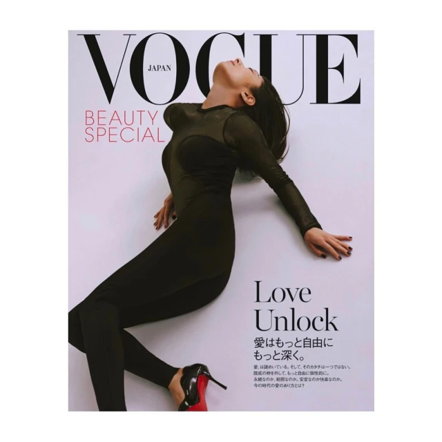 Vogue Japan cover featuring a woman in a black bodysuit and heels, lying against a white background with magazine text elements.