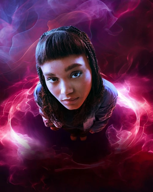 Young adult woman with braided hair gazes upward, captured from a low angle with vibrant purple and pink abstract smoke in the background.