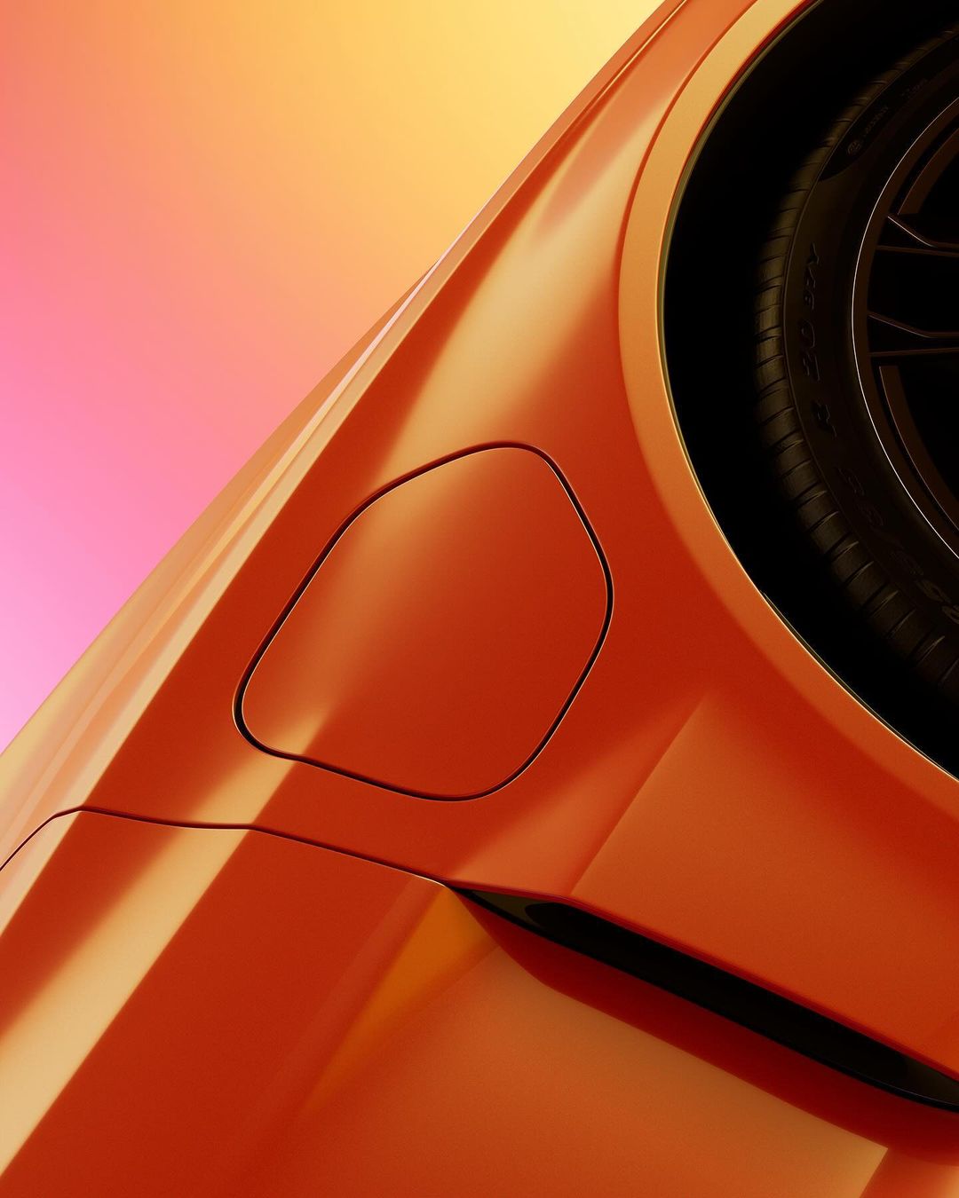 Close-up of an orange car exterior focusing on the wheel well, tyre, and sleek body lines under soft studio lighting, showing modern automotive design.