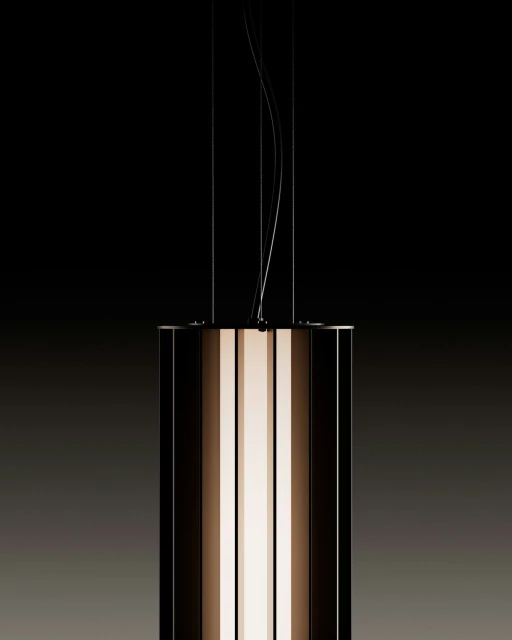 Modern pendant light fixture with a cylindrical shape and a combination of dark and illuminated panels, hanging against a dark background.