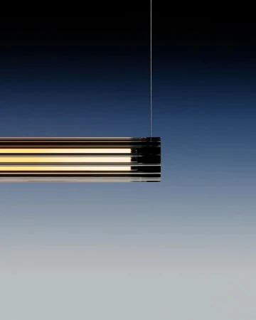 Minimalist interior lighting fixture hanging from a cord against a gradient blue background with a modern, sleek design and warm light.