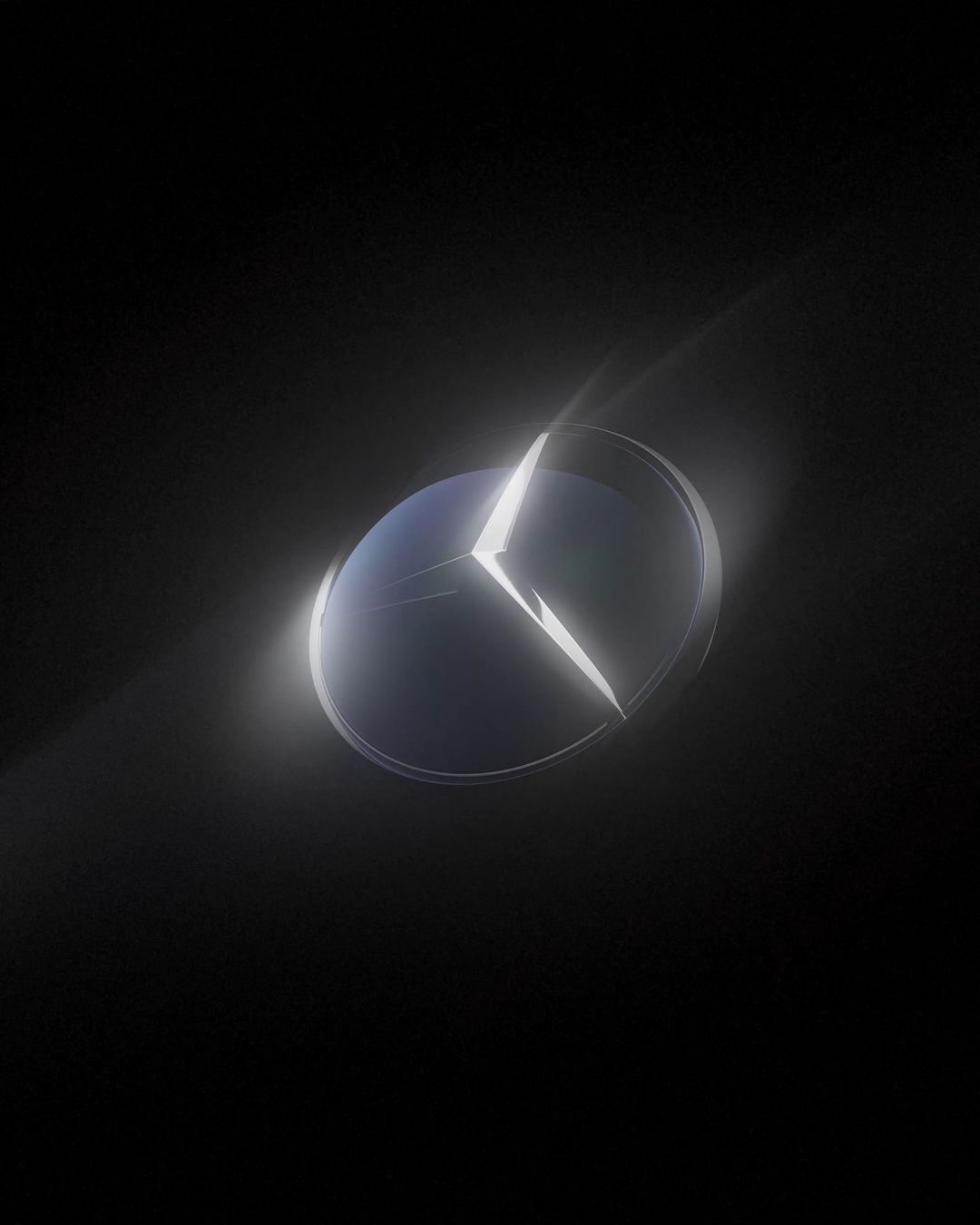 Illuminated Mercedes-Benz logo against a dark backdrop, creating a striking, high-contrast image highlighting the iconic emblem.