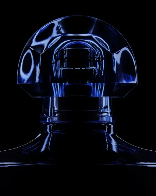 Close-up of a translucent blue crystal perfume bottle, with dark background and subtle lighting enhancing its faceted structure.