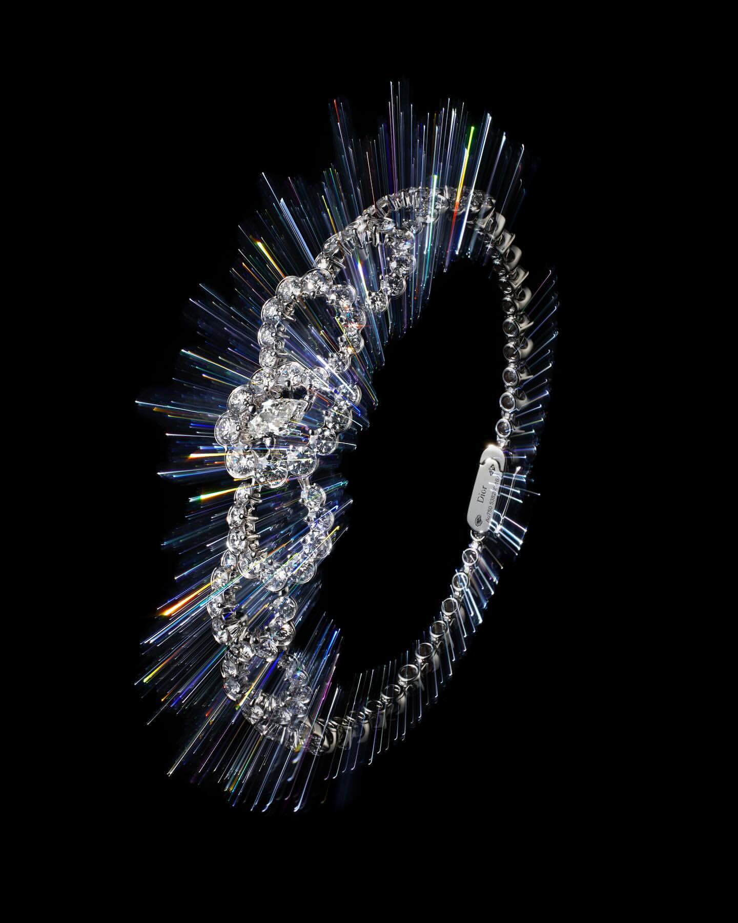A sparkling diamond bracelet with iridescent light rays on a stark black background creating a dramatic, high-contrast jewelry shot.