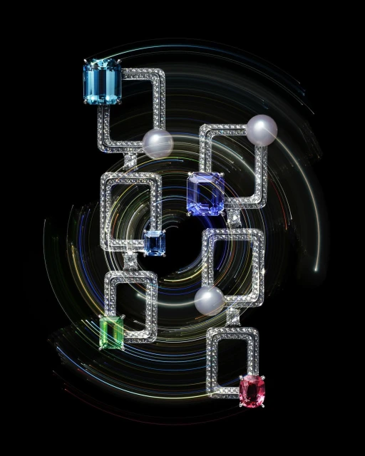 Elegant diamond necklace featuring colorful gemstones and pearl, set against a black backdrop with dynamic light trails.