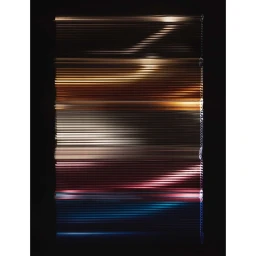 Abstract long-exposure photograph featuring horizontal light streaks with metallic and neon hues against a dark background