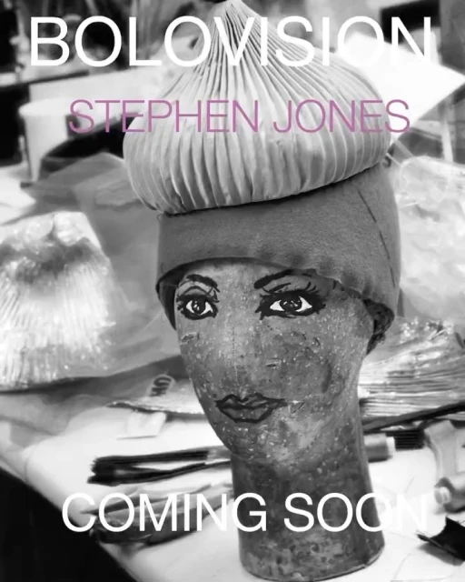 Monochrome studio shot of a painted mannequin head wearing a layered, pleated hat with the text 'Bolovision' and 'Coming Soon'.