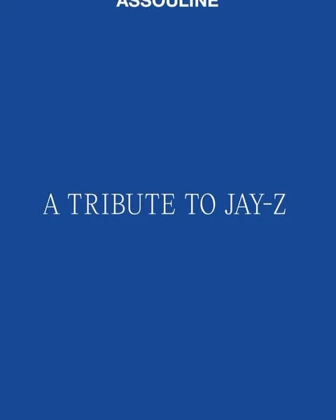 Book cover for 'A Tribute to Jay-Z' by Assouline. Cobalt blue background with white sans-serif typeface. Minimalist book cover design.