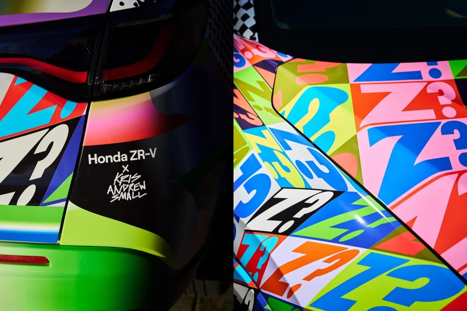Close-up of car hood and rear, featuring vibrant graphic art with question marks and abstract shapes. Honda ZR-V logo present on the rear.