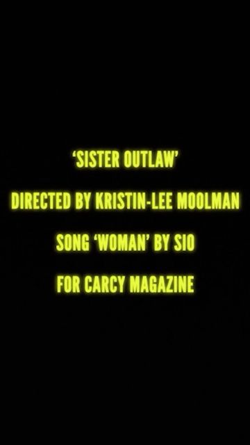 Text on a dark background displays the title 'Sister Outlaw' directed by Kristin-Lee Moolman, song 'Woman' by Sio for Carcy Magazine.